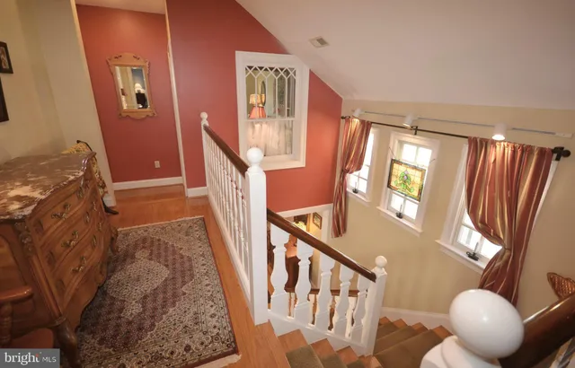 a bedroom with a bed and a television