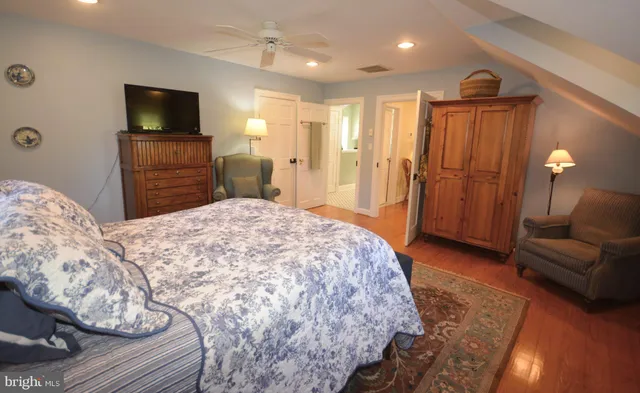 a bedroom with two beds and a window