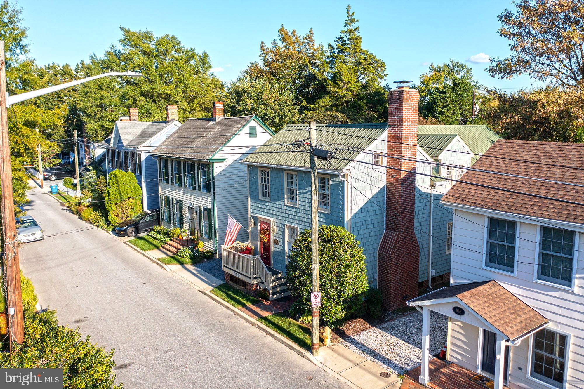 106 Grace Street St. Michaels, MD 21663 - Photo 9 of 57 a front view of a house with garden