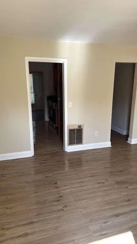 a view of a living room with a hallway
