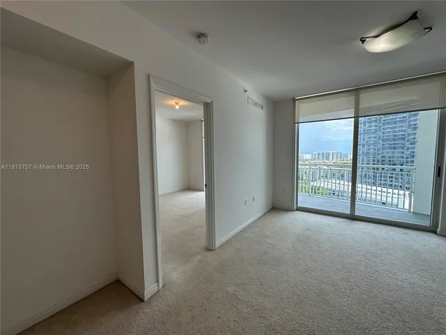 a view of balcony and a kitchen