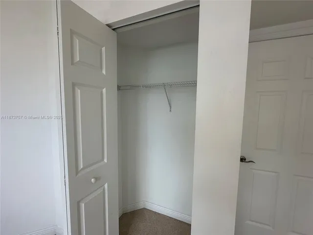 a bathroom with a shower and a toilet