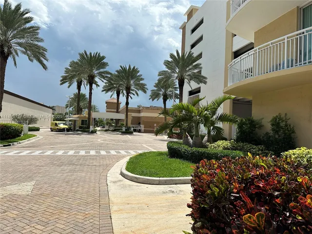a view of outdoor space with palm trees