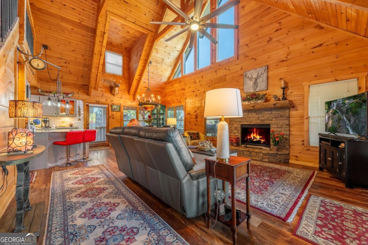 709 Laurel Creek Trail Blue Ridge, GA 30513 - Photo 14 of 87 a view of a chairs and tables in the back yard of the house