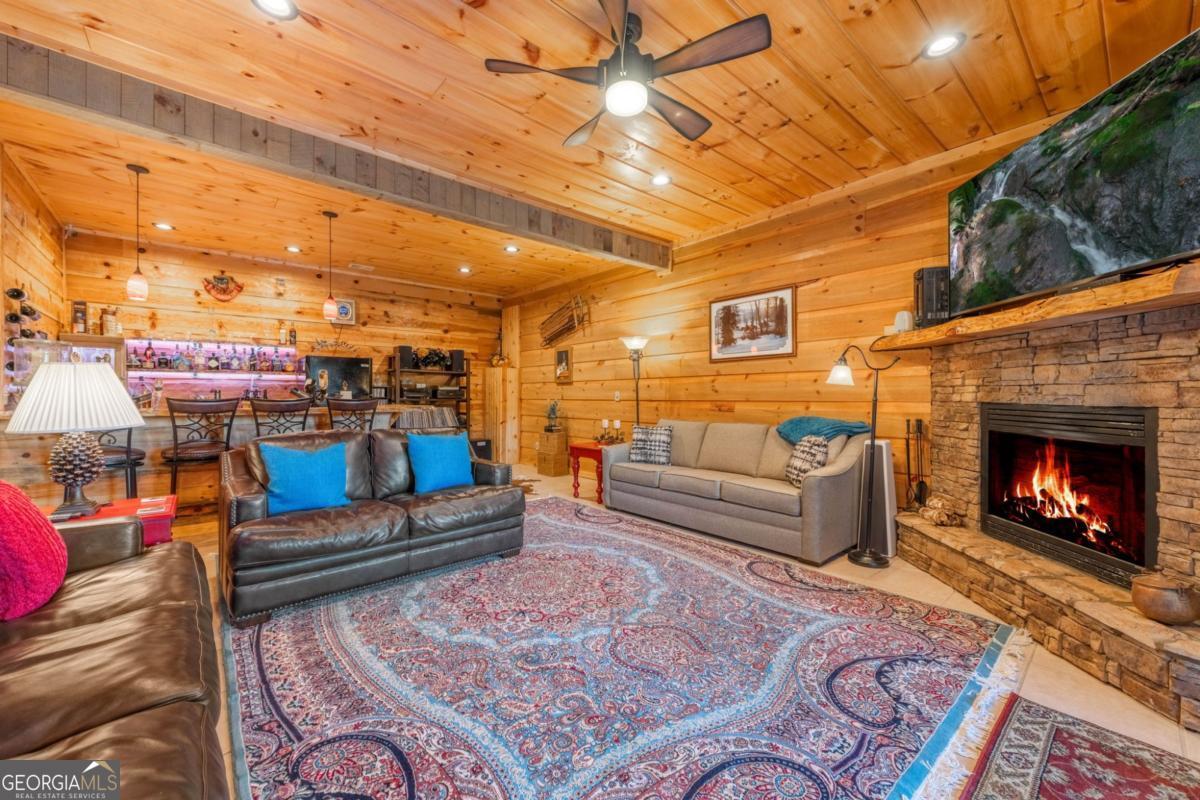 709 Laurel Creek Trail Blue Ridge, GA 30513 - Photo 19 of 87 a living room with furniture and a fireplace