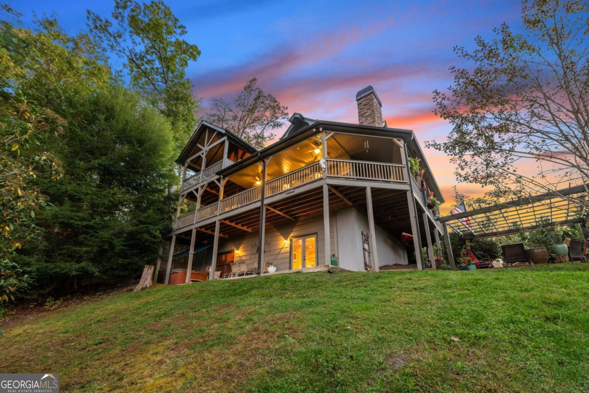 709 Laurel Creek Trail Blue Ridge, GA 30513 - Photo 2 of 87 a front view of a house with garden