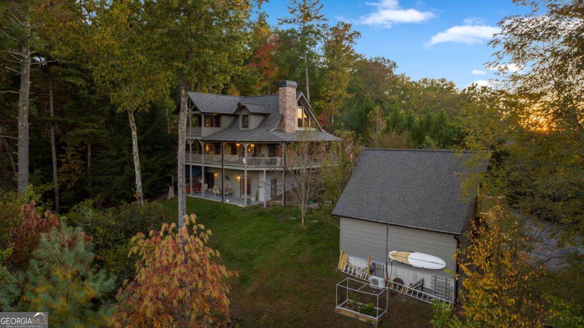 709 Laurel Creek Trail Blue Ridge, GA 30513 - Photo 48 of 87 a view of a house with pool and garden