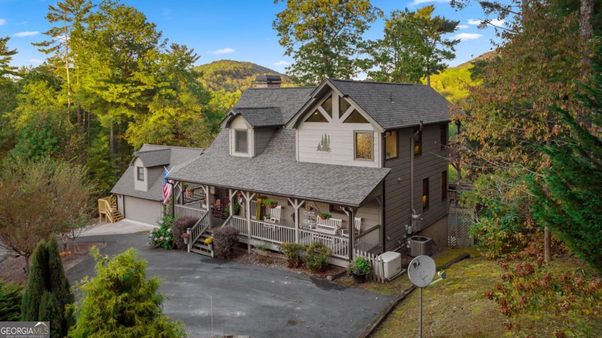 709 Laurel Creek Trail Blue Ridge, GA 30513 - Photo 65 of 87 an aerial view of a house with a yard table and chairs