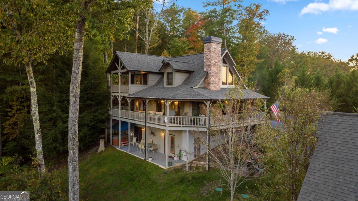 709 Laurel Creek Trail Blue Ridge, GA 30513 - Photo 84 of 87 a view of a house with roof deck front of house