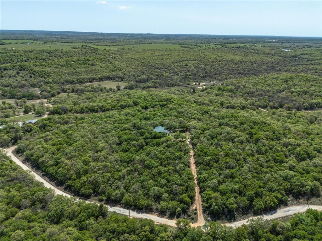 900 Hill Top Road Nocona, TX 76255 - Photo 4 of 12 an aerial view of residential houses with outdoor space and trees