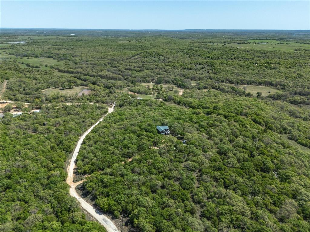 900 Hill Top Road Nocona, TX 76255 - Photo 5 of 12 an aerial view of residential houses with outdoor space and trees