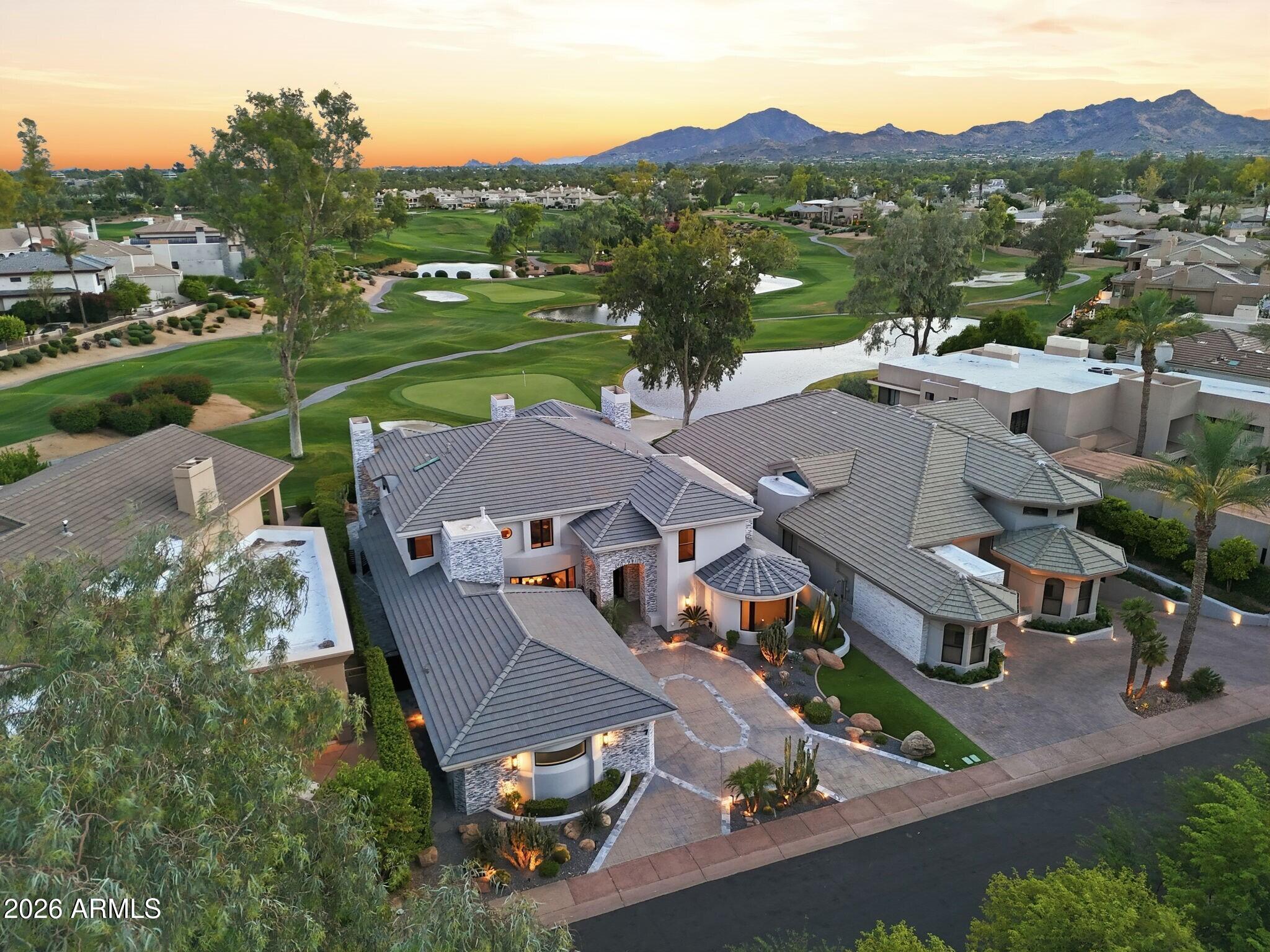 7475 East Gainey Ranch Road, Unit 7 Scottsdale, AZ 85258 - Photo 7 of 77 an aerial view of a house with garden space and street view