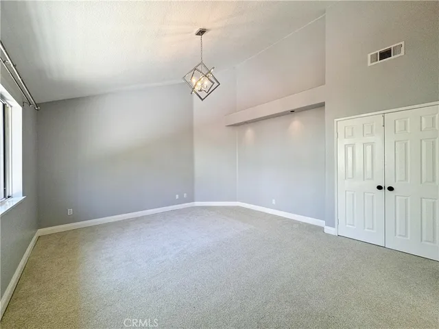 a view of an empty room with windows