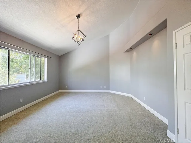 a view of room with window and ceiling fan