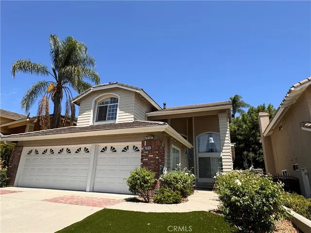 a front view of a house with a garage