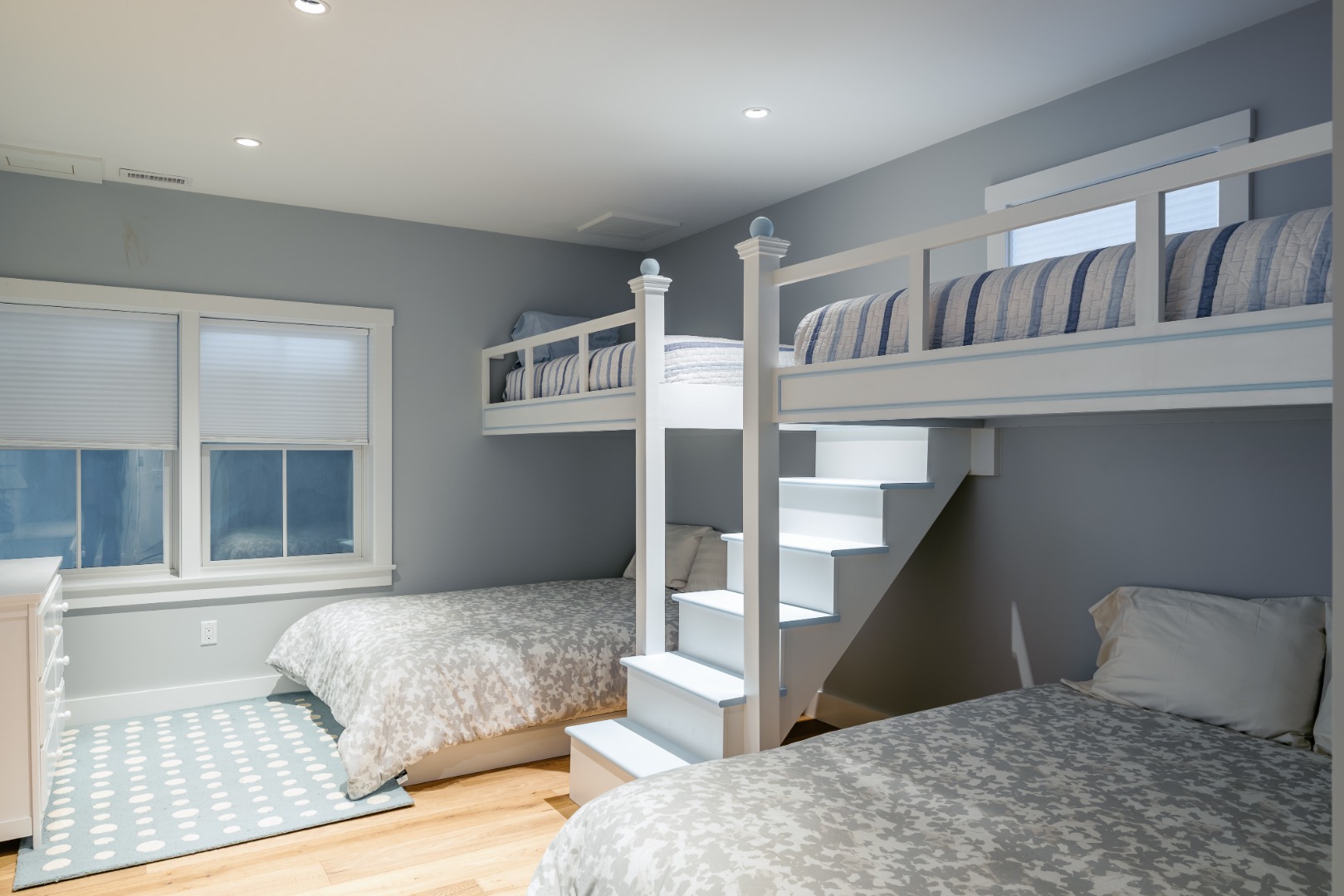 86 Cliff Road Nantucket, MA 02554 - Photo 22 of 29 a bedroom with a large bed and a large window