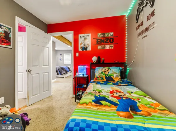 a bedroom with bed and window