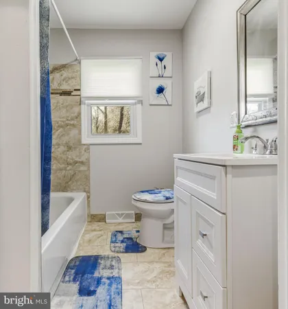 a bathroom with a bathtub sink and toilet