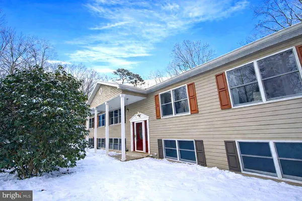 a view of a house with a patio and balcony
