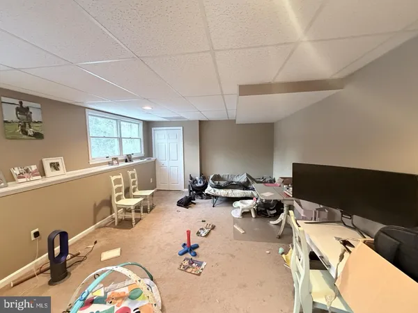 a room with furniture and a flat screen tv