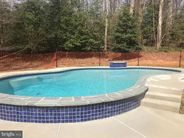 a view of a swimming pool with an outdoor space