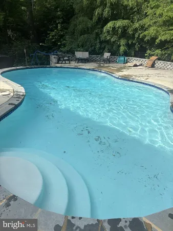 a view of outdoor space with swimming pool
