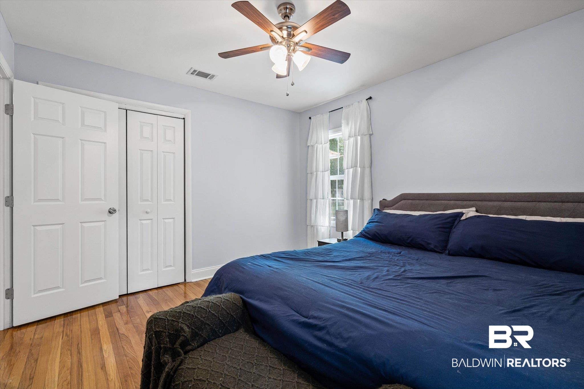 5609 Diane Court Mobile, AL 36618 - Photo 14 of 22 Bedroom with wood finished floors, a closet, and ceiling fan