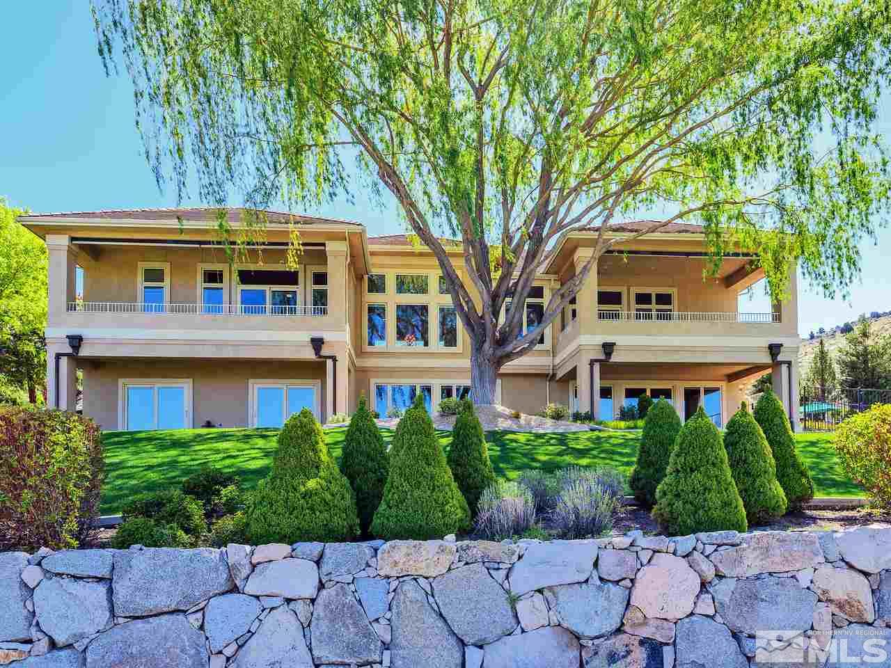 1180 Paddock Lane Reno, NV 89521 - Photo 2 of 25 a front view of a house with a yard