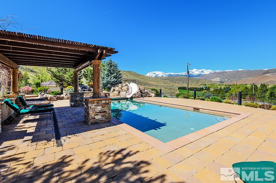 1180 Paddock Lane Reno, NV 89521 - Photo 21 of 25 a view of a patio with swimming pool