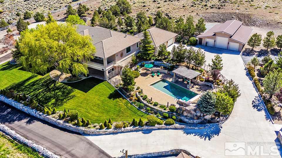 1180 Paddock Lane Reno, NV 89521 - Photo 24 of 25 an aerial view of a house with a garden and swimming pool