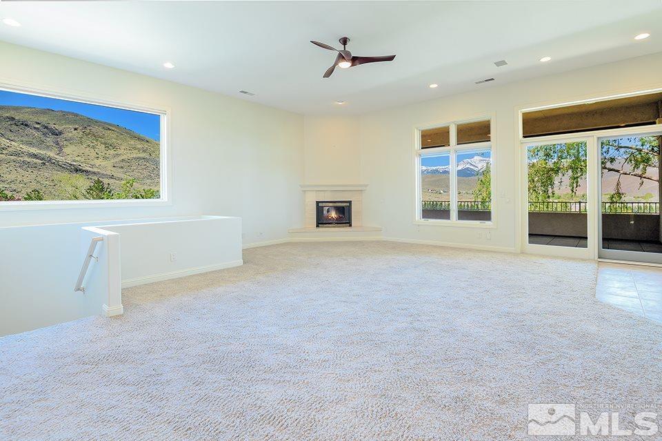 1180 Paddock Lane Reno, NV 89521 - Photo 7 of 25 a view of an empty room with a window and kitchen view