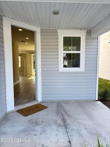 a view of entryway with wooden floor