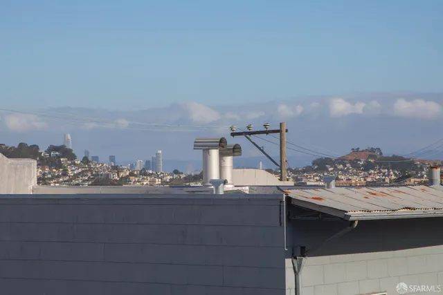 a view of roof deck with furniture