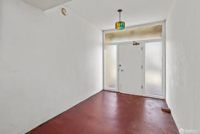 a kitchen with stainless steel appliances granite countertop a refrigerator a stove and a sink