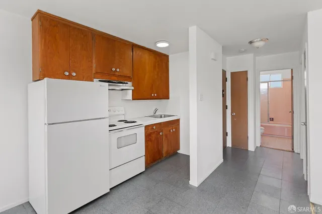 a kitchen with a stove and a microwave