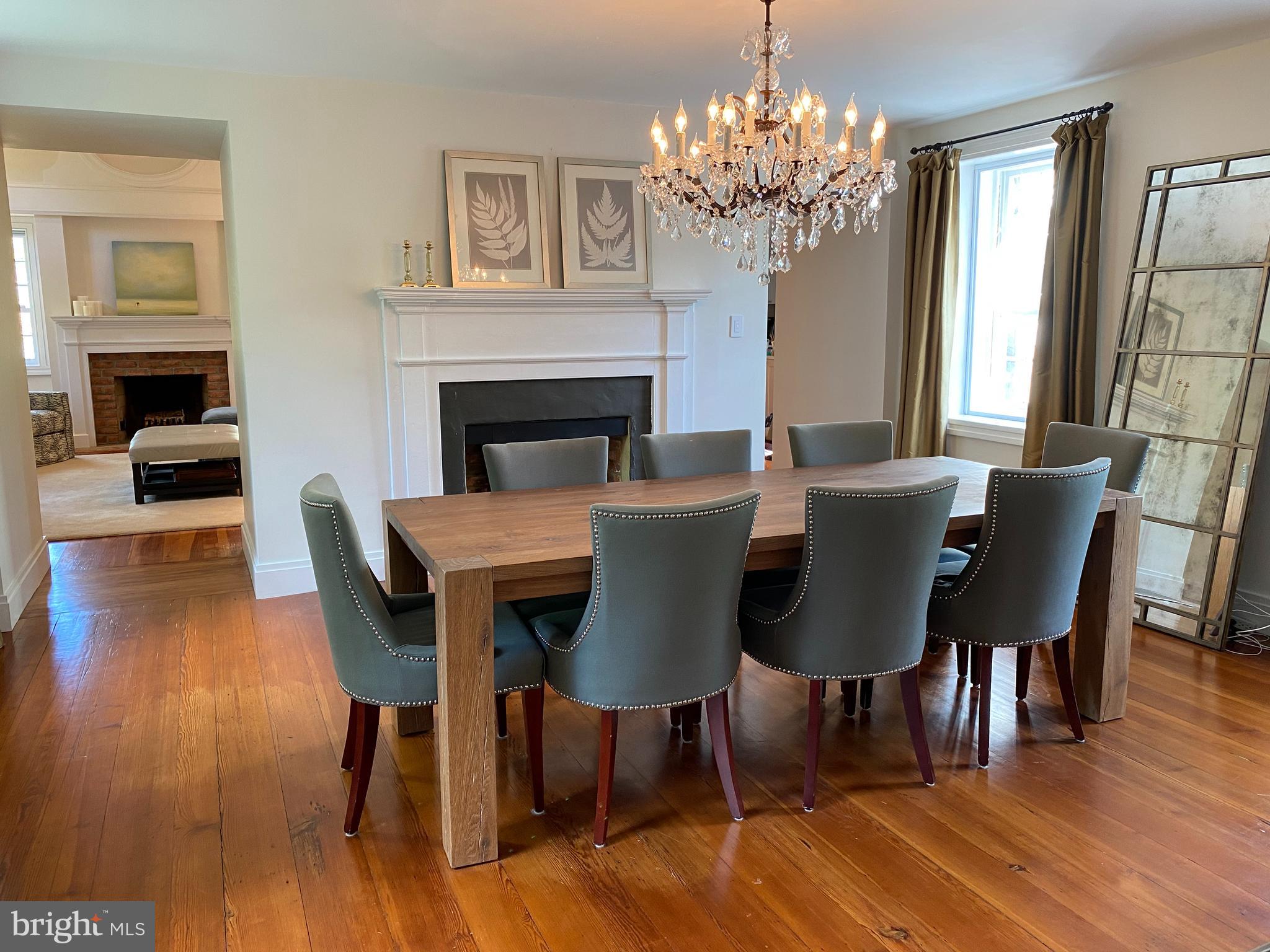 121 Upnor Road Baltimore, MD 21212 - Photo 21 of 79 a view of a dining room with furniture a chandelier and wooden floor