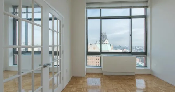 a view of an entryway with wooden floor