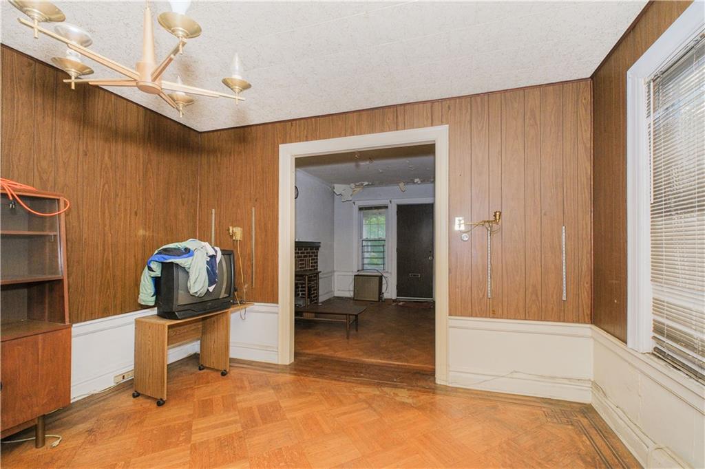 660 85th Street Brooklyn, NY 11228 - Photo 11 of 32 a view of a hallway and a livingroom with furniture