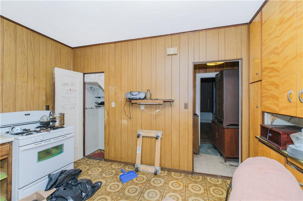 660 85th Street Brooklyn, NY 11228 - Photo 14 of 32 a bedroom with a bed and a dresser