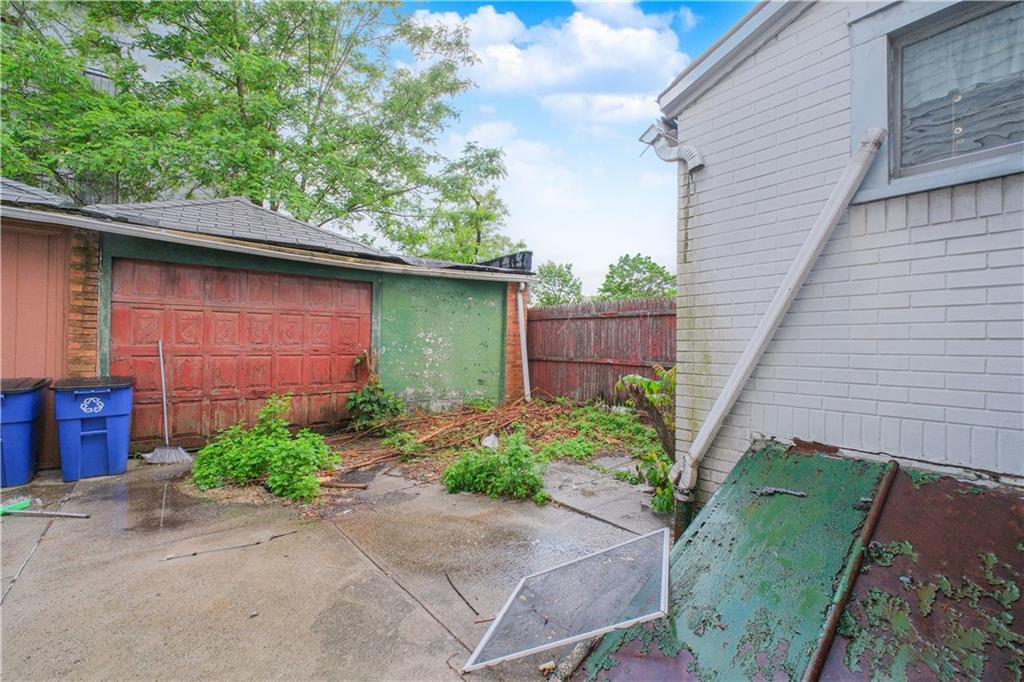 660 85th Street Brooklyn, NY 11228 - Photo 5 of 32 a backyard of a house with plants