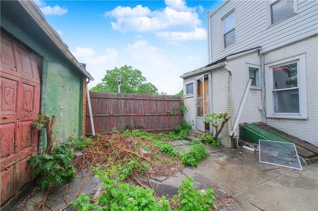 660 85th Street Brooklyn, NY 11228 - Photo 6 of 32 a backyard of a house with lots of green space