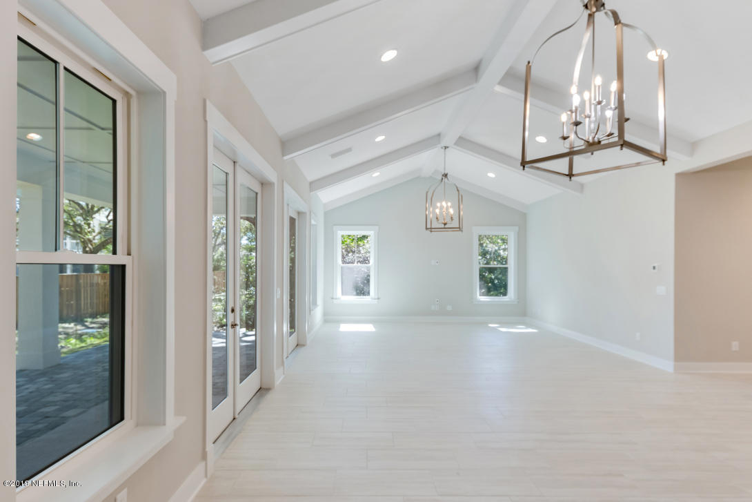 434 Ridgeway Road St. Augustine Beach, FL 32080 - Photo 2 of 23 an empty room with wooden floor and windows