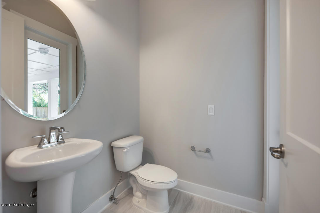 434 Ridgeway Road St. Augustine Beach, FL 32080 - Photo 23 of 23 a bathroom with a sink mirror and toilet