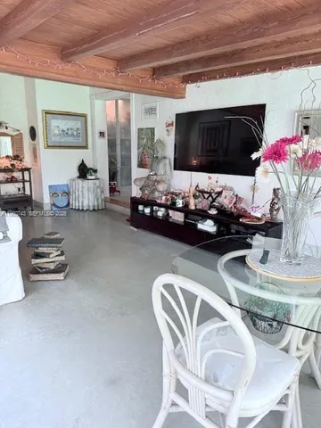 a kitchen with a table and chairs