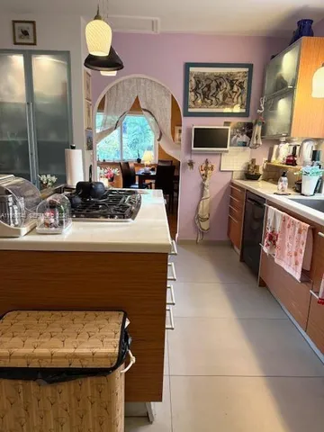 a kitchen with a sink and a stove top oven