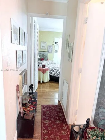 a bedroom with furniture and a rug