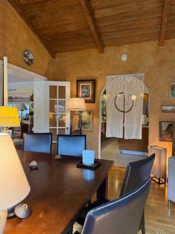 a living room with fireplace furniture and a rug