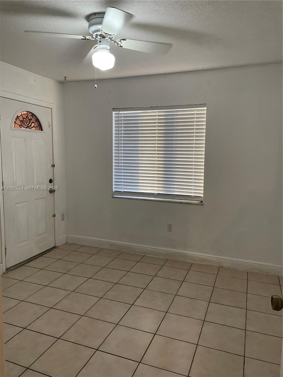 14770 Southwest 60th Street Miami, FL 33193 - Photo 14 of 16 a view of an empty room with a window
