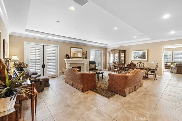a living room with fireplace furniture and a table