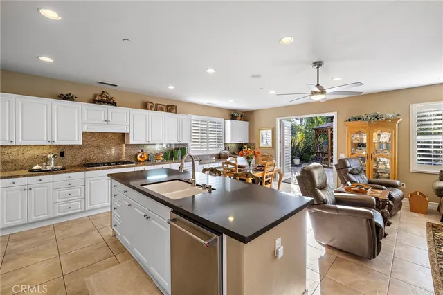a view of a house with backyard sitting area and garden